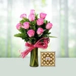 Send 10 Pink Roses Flowers Bouquet In A Glass Vase And Ferrerorocher Chocolates Gift Online in India