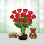 Send 12 Red Roses Flowers Bouquet with Half Kg Chocolate Cake And Teddy Gift Online in India