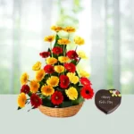 Send 20 Yellow And Red Gerbera Flowers Bouquets with 1 kg Heart Shaped Chocolate Cake Gift Online in India